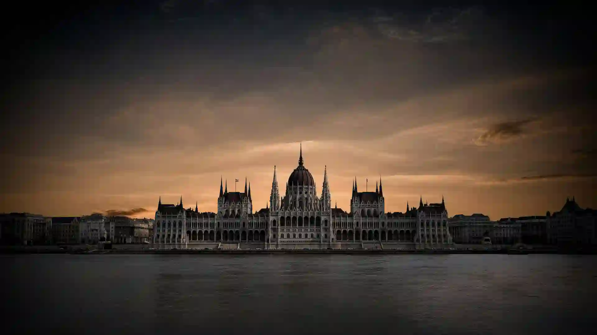 The Hungarian Parliament Building is a neo-Gothic masterpiece located on the banks of the Danube. With its iconic dome and intricate facade, it is a symbol of Hungary's rich history and culture. Visitors can take guided tours to admire its grand interiors, including the Holy Crown of Hungary. The building is particularly stunning when illuminated at night.