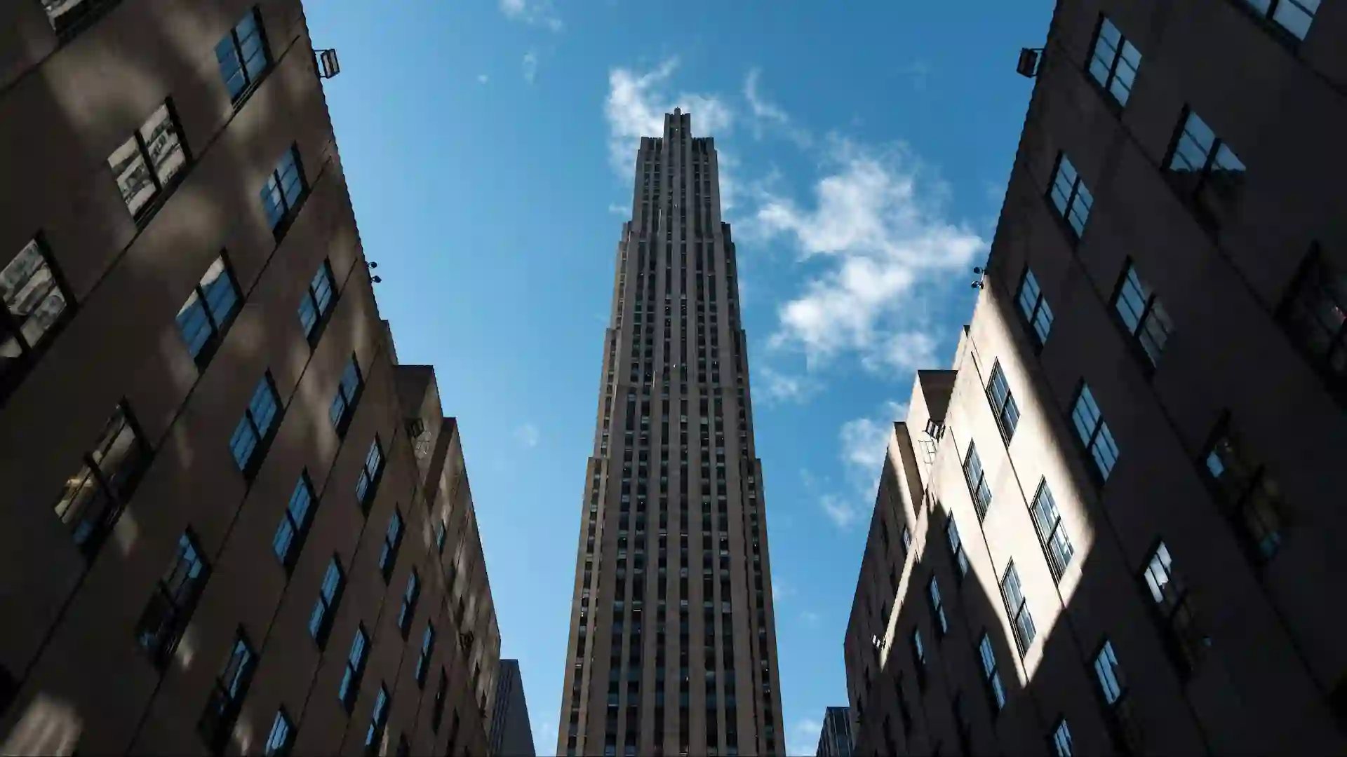 Top of the Rock Observation Deck at Rockefeller Center provides 360-degree views of New York City, including iconic landmarks like the Empire State Building and Central Park.