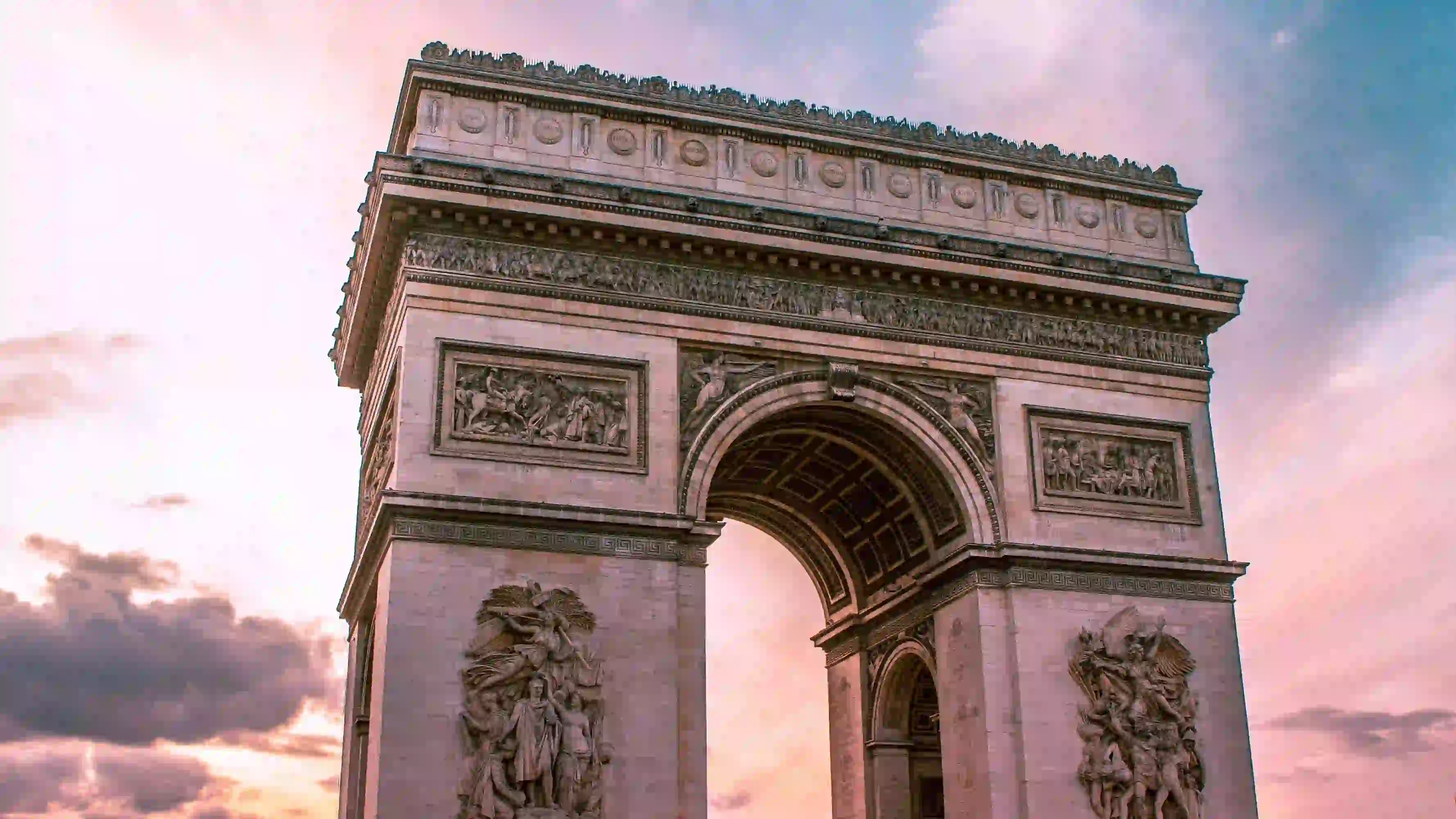 The Champs-Élysées is Paris’s most famous avenue, known for its theaters, cafés, and luxury shops. At its western end stands the Arc de Triomphe, commissioned by Napoleon to honor his army. Visitors can climb to the top of the arch for sweeping views of Paris. This area is particularly festive during national holidays and the Tour de France.